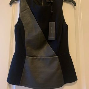 Bcbg black sleeveless top with slit in front leather like detail